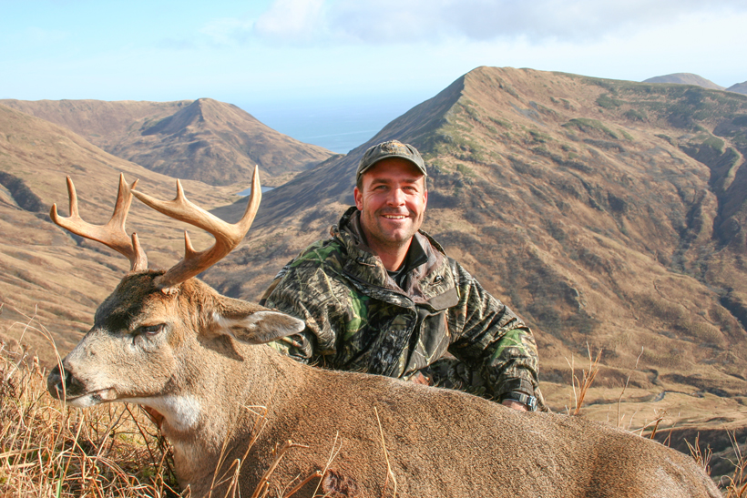 Dave Loescher with a blacktail deer Dave Loescher with a blacktail deer